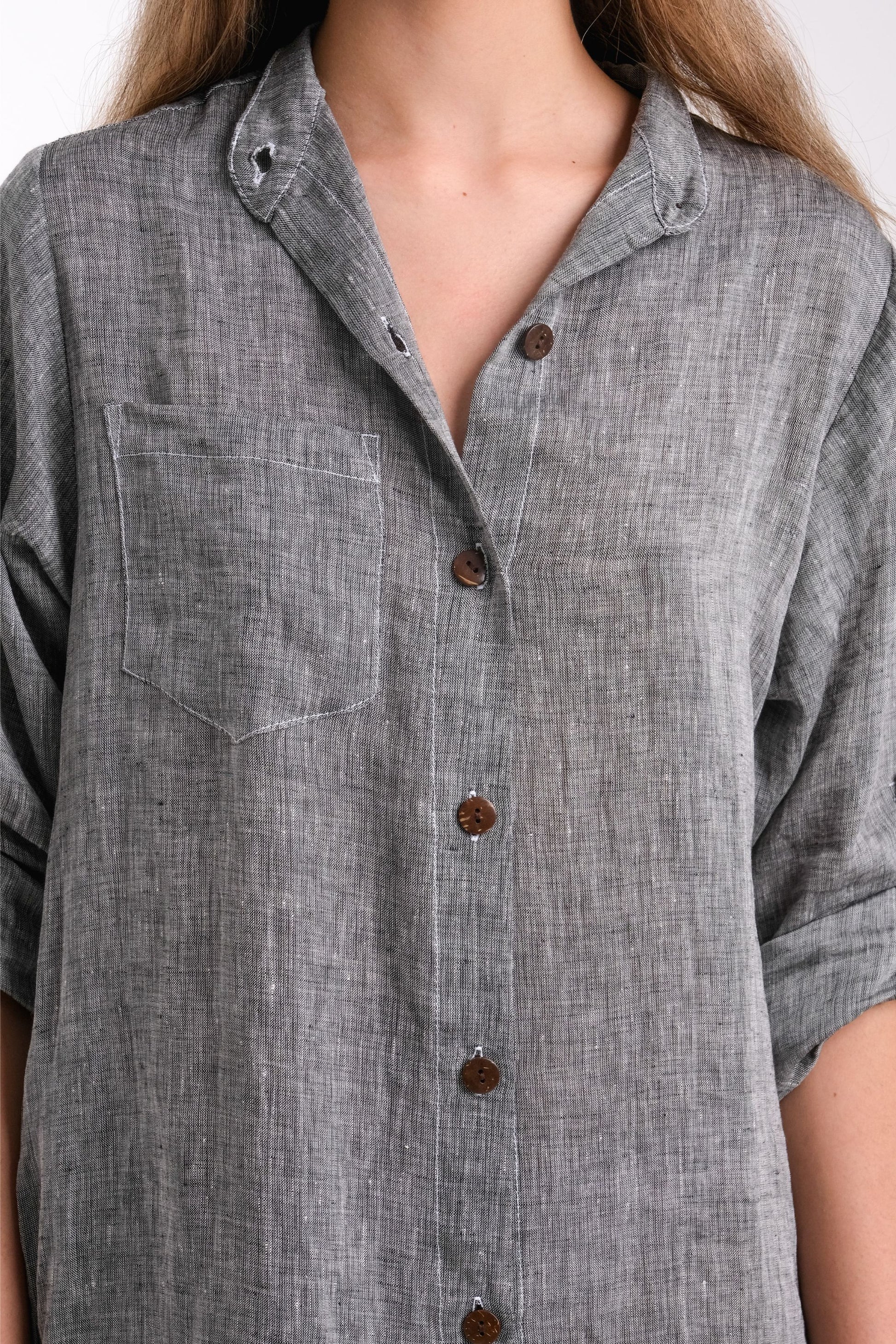 Womens long sleeved grey shirt dress close up
